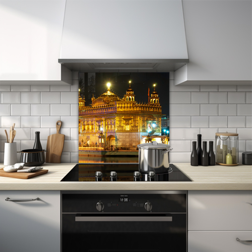 Night view of the Golden Temple's detailed golden architecture.