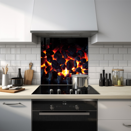 Close-up of coals on fire in a fireplace glass splashback.