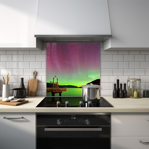 Green northern lights over Porteau Cove with mountains glass splashback.