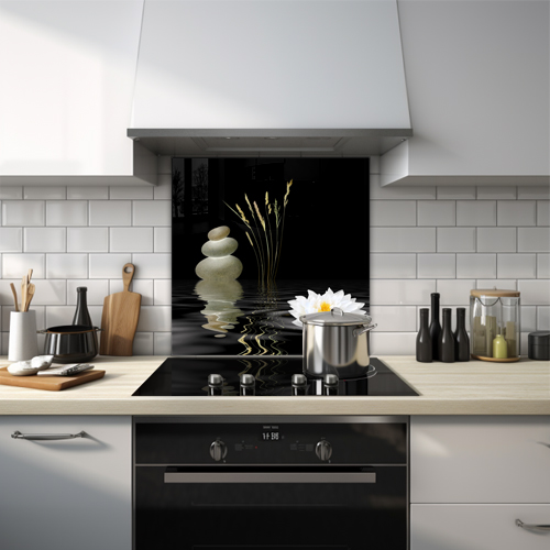 Water scene with white flower and stacked pebbles in a zen garden glass splashback.