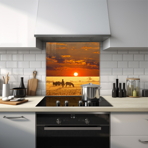Zebras on African plain with a ball of fire sun during cloudy sunset glass splashback.