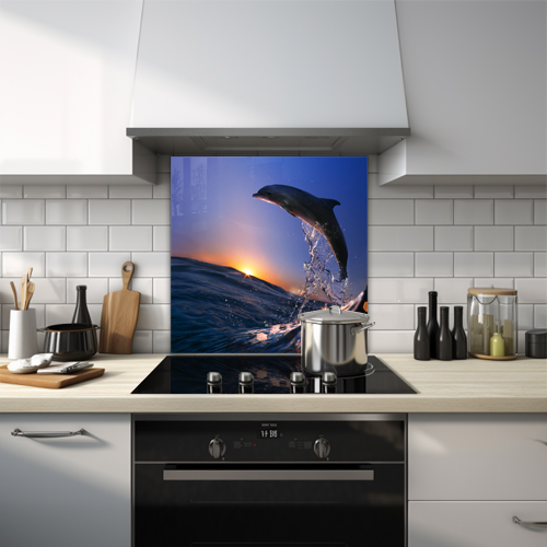 Dolphin jumping against the backdrop of a stunning sunset glass splashback.