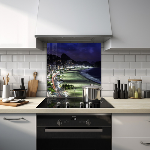 Copacabana Beach illuminated at night with Rio mountains backdrop glass splashback.
