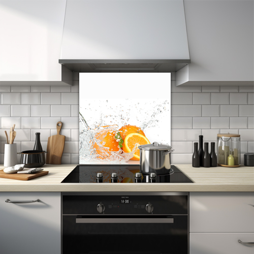 Orange being splashed with water glass splashback.