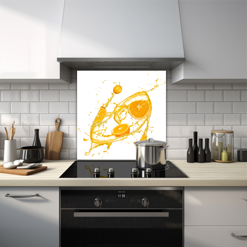 Orange coloured liquid splash with cut oranges glass splashback.