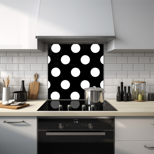 White polka dots on black glass splashback.