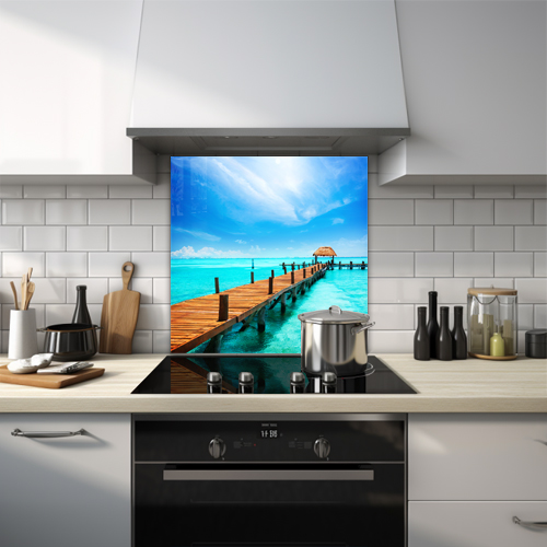 Tropical island pier under a bright blue sky glass splashback.