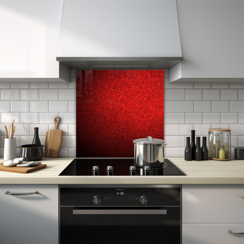 Detailed red flower pattern on black background glass splashback.