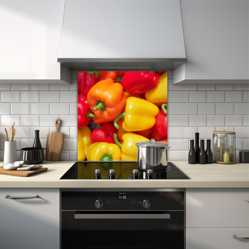Glass splashback showcasing a bunch of red, yellow, and orange peppers.