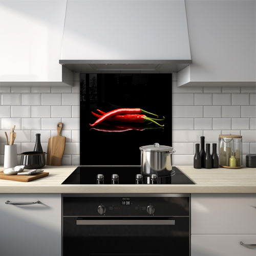 Glass splashback of three red chillies against a black background.