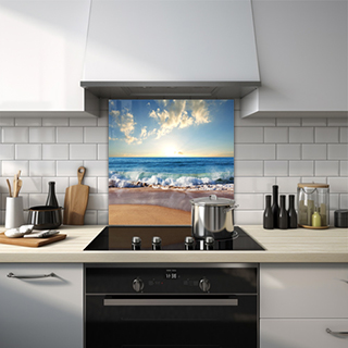 Ocean waves on sandy beach with sunset glass splashback. thumbnail