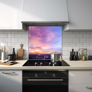 Purple sky over city at sunset glass splashback. thumbnail