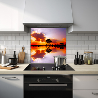 African sunset with tree silhouettes reflected in water glass splashback. thumbnail