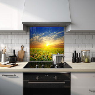 Field of sunflowers under a sunset with wispy clouds glass splashback. thumbnail