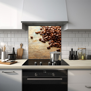 Glass splashback of coffee beans scattered on a wooden table. thumbnail