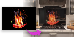 A fiery red chilli splashback on black background by Paul